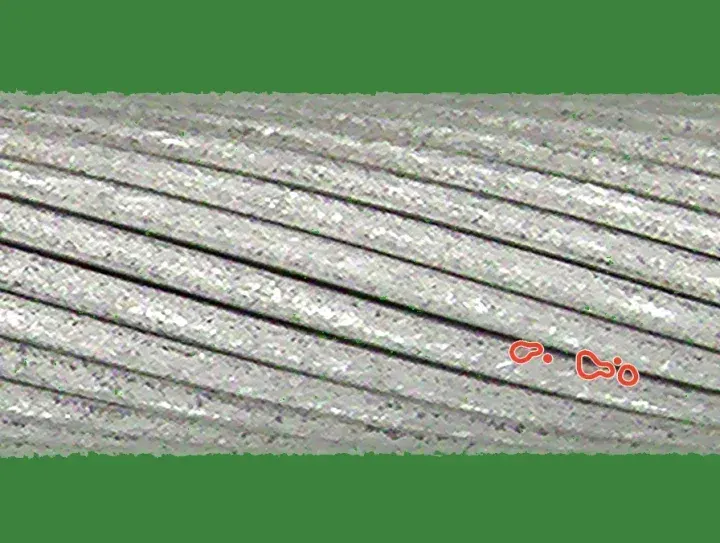 Training crop with a drawn speckled deposit: two small speckled patches, outlined in red.